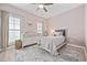 Charming bedroom with a patterned rug, dresser, comfortable bed, and natural light at 175 Summer Wind Loop, Murrells Inlet, SC 29576
