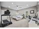 Large bedroom with neutral walls, a ceiling fan, and versatile space for a home office or gym at 175 Summer Wind Loop, Murrells Inlet, SC 29576