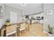 Dining area leads to a well-equipped kitchen with hardwood floors and plenty of light at 175 Summer Wind Loop, Murrells Inlet, SC 29576