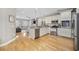 Open-concept kitchen with stainless appliances and granite counters flows into a comfortable living space at 175 Summer Wind Loop, Murrells Inlet, SC 29576