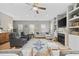 Bright living room with a fireplace, hardwood floors, ceiling fan and comfortable seating arrangement at 175 Summer Wind Loop, Murrells Inlet, SC 29576