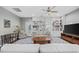 Spacious living room boasts custom built-in shelving, lots of natural light, and elegant furnishings at 175 Summer Wind Loop, Murrells Inlet, SC 29576
