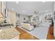 Open-concept living room features hardwood floors, built-in shelves, and lots of natural light at 175 Summer Wind Loop, Murrells Inlet, SC 29576