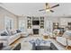 Bright living room with a fireplace, hardwood floors, ceiling fan and comfortable seating arrangement at 175 Summer Wind Loop, Murrells Inlet, SC 29576