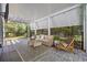 Inviting outdoor porch with cozy seating, string lights, and serene backyard views at 175 Summer Wind Loop, Murrells Inlet, SC 29576