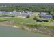 Scenic aerial view of waterfront condo community with golf course and lagoon at 1912 Goose Creek Rd. Sw # 4302, Ocean Isle Beach, NC 28469