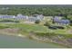 Scenic aerial view of waterfront condo community with golf course and lagoon at 1912 Goose Creek Rd. Sw # 4302, Ocean Isle Beach, NC 28469