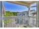 Balcony overlooking parking area and distant buildings, offering natural light and outdoor space at 1912 Goose Creek Rd. Sw # 4302, Ocean Isle Beach, NC 28469