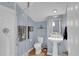 Bathroom with glass enclosed shower, a pedestal sink, and light blue walls at 1912 Goose Creek Rd. Sw # 4302, Ocean Isle Beach, NC 28469