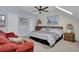 Bedroom featuring bed, love seat, ceiling fan, and complementary decor at 1912 Goose Creek Rd. Sw # 4302, Ocean Isle Beach, NC 28469