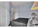 Comfortable bedroom with serene blue walls and cozy decor, complemented by natural light at 1912 Goose Creek Rd. Sw # 4302, Ocean Isle Beach, NC 28469