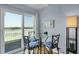 Bright dining area with table and seating, providing stunning outdoor views with natural light at 1912 Goose Creek Rd. Sw # 4302, Ocean Isle Beach, NC 28469