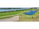 Picturesque view of golf course alongside waterfront with walking path at 1912 Goose Creek Rd. Sw # 4302, Ocean Isle Beach, NC 28469