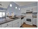 Well-equipped kitchen featuring granite countertops, stainless steel appliances, and custom cabinetry at 1912 Goose Creek Rd. Sw # 4302, Ocean Isle Beach, NC 28469