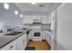Bright kitchen with white cabinets, modern appliances, and ample counter space at 1912 Goose Creek Rd. Sw # 4302, Ocean Isle Beach, NC 28469