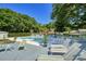 Relaxing community pool area with lounge chairs and lush landscaping at 1912 Goose Creek Rd. Sw # 4302, Ocean Isle Beach, NC 28469