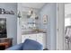 Convenient wet bar featuring cabinetry, mirror shelving, and a sink for easy entertaining at 1912 Goose Creek Rd. Sw # 4302, Ocean Isle Beach, NC 28469