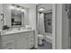 Bathroom with vanity, updated mirror lights, toilet, and shower-tub combo at 2001 S Ocean Blvd. # 721, Myrtle Beach, SC 29577