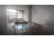 Indoor hot tub with windows and tiled floors at condo at 2001 S Ocean Blvd. # 721, Myrtle Beach, SC 29577