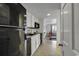Well-lit kitchen features black appliances, white cabinetry, and tile flooring at 2001 S Ocean Blvd. # 721, Myrtle Beach, SC 29577