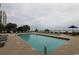 Outdoor pool with lounge chairs and ocean views at condo building at 2001 S Ocean Blvd. # 721, Myrtle Beach, SC 29577