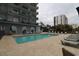 Condo pool with lounge chairs and building views on a cloudy day at 2001 S Ocean Blvd. # 721, Myrtle Beach, SC 29577