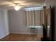 Comfortable bedroom features a ceiling fan, neutral decor, and window unit at 201 76Th Ave. N # E3, Myrtle Beach, SC 29577