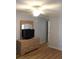 Bedroom with light wood floors, ceiling fan and a dresser with a TV at 201 76Th Ave. N # E3, Myrtle Beach, SC 29577
