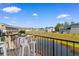 Relax on the balcony with views of the water and landscaped community at the Grand Palms Resort at 210 Double Eagle Dr. # B-2, Surfside Beach, SC 29575