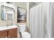 Well-lit full bath with a vanity, mirror, decorative lighting, and a shower-tub combo at 210 Double Eagle Dr. # B-2, Surfside Beach, SC 29575