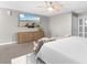 Serene bedroom with a ceiling fan, beach-scene TV, and comfortable seating at 210 Double Eagle Dr. # B-2, Surfside Beach, SC 29575