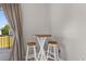 Cozy breakfast nook with stools offering a view of the exterior homes and access to the deck at 210 Double Eagle Dr. # B-2, Surfside Beach, SC 29575