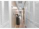 Hallway with modern light fixtures, and closet doors, suggesting organized storage throughout the living space at 210 Double Eagle Dr. # B-2, Surfside Beach, SC 29575