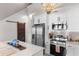 Modern kitchen showcasing stainless appliances, white cabinets, and a barn door accent at 210 Double Eagle Dr. # B-2, Surfside Beach, SC 29575