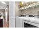 Convenient laundry room with modern washer and dryer and ample storage space at 210 Double Eagle Dr. # B-2, Surfside Beach, SC 29575