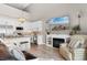 Open-concept living area featuring a modern fireplace, TV, kitchen, and comfortable seating at 210 Double Eagle Dr. # B-2, Surfside Beach, SC 29575