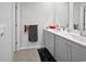 Bathroom featuring double vanity, neutral walls, and tile flooring at 2230 Ainsley Dr., Little River, SC 29566