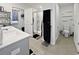 Modern bathroom with double sink, tile floor, shower, and toilet at 2230 Ainsley Dr., Little River, SC 29566