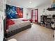 Well-lit bedroom with carpet, a bed with red pillows and an assortment of toys at 2230 Ainsley Dr., Little River, SC 29566