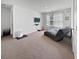 Comfortable bonus room with neutral carpeting, window with bright natural light, and relaxing chaise lounge at 2230 Ainsley Dr., Little River, SC 29566