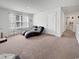 Bright bonus room with neutral carpeting, window with bright natural light, and relaxing chaise lounges at 2230 Ainsley Dr., Little River, SC 29566