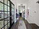 Hallway view featuring French doors, coat racks, wall shelves, and entry to living spaces at 2230 Ainsley Dr., Little River, SC 29566