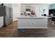 Bright, open kitchen featuring gray cabinets, stainless appliances, granite countertops, and a large island at 2230 Ainsley Dr., Little River, SC 29566