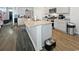 Bright kitchen featuring gray cabinets, stainless appliances, a large island, and pet feeding area at 2230 Ainsley Dr., Little River, SC 29566
