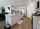 Bright, open kitchen featuring gray cabinets, stainless appliances, granite countertops, and an island with sink at 2230 Ainsley Dr., Little River, SC 29566