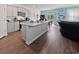 Bright, open kitchen featuring gray cabinets, stainless appliances, granite countertops, and a large island at 2230 Ainsley Dr., Little River, SC 29566