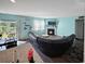Cozy living room with blue accent walls, fireplace, and access to the back deck at 2230 Ainsley Dr., Little River, SC 29566