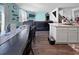 Open floor plan with kitchen, dining area, and living room with fireplace and a TV at 2230 Ainsley Dr., Little River, SC 29566