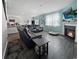 Living room with a fireplace, TV, and a leather couch next to an open floor-plan kitchen at 2230 Ainsley Dr., Little River, SC 29566