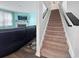 Cozy living room with fireplace, TV and a staircase leading to the upper floor at 2230 Ainsley Dr., Little River, SC 29566